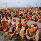 Sadhus Sit Down for a Free Meal