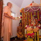 Srila Guru Maharaja Offering Arati to Prabhupada